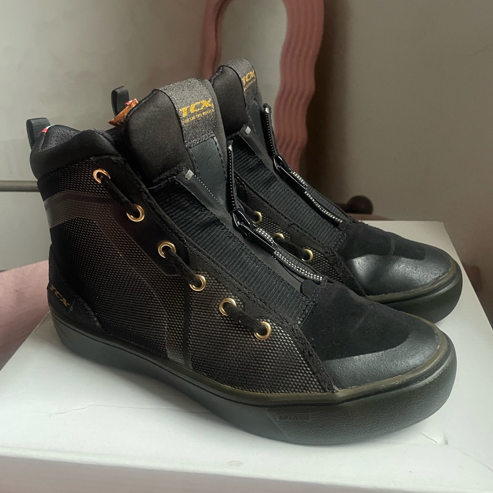 Stylish Black Ankle Boots with Gold Accents